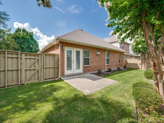 7425 Ty Cir, Mckinney, TX 75072 - rear view of property featuring brick siding, a gate, a fenced backyard, a patio, and french doors