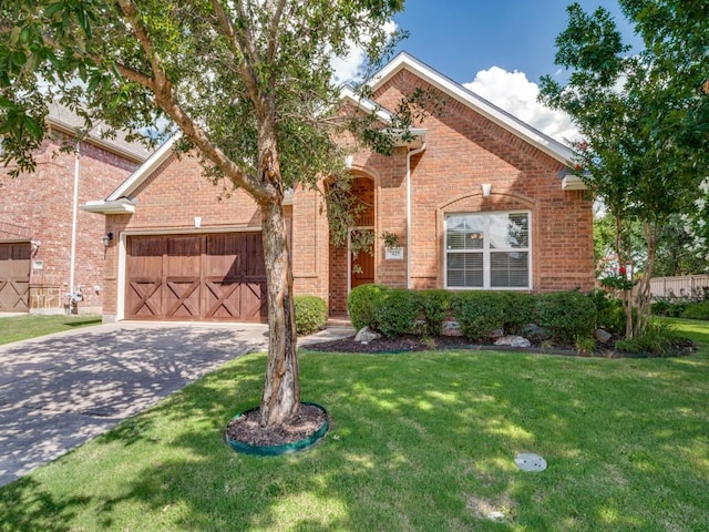 7425 Ty Cir, Mckinney, TX 75072 - traditional-style house featuring a garage, driveway, a front yard, and brick siding