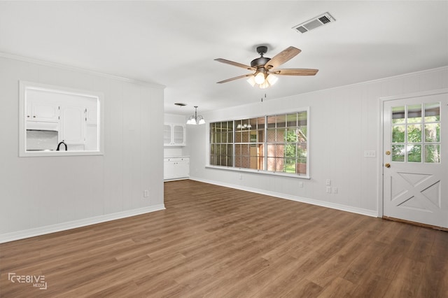 926 Edgefield Dr, Shreveport, LA 71118 - unfurnished living room featuring ornamental molding, a ceiling fan, wood finished floors, and a chandelier