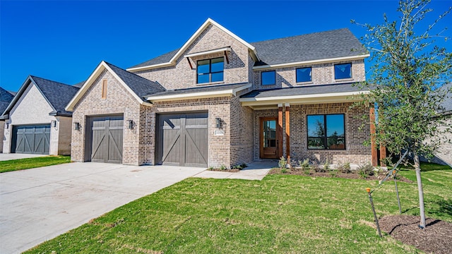 14848 Grissom Ave, Aledo, TX 76008 - view of front of home featuring concrete driveway, brick siding, and a front yard