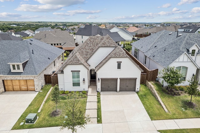 1713 Purple Thistle Ln, Fort Worth, TX 76008 - view of front facade featuring a residential view, concrete driveway, stucco siding, and an attached garage