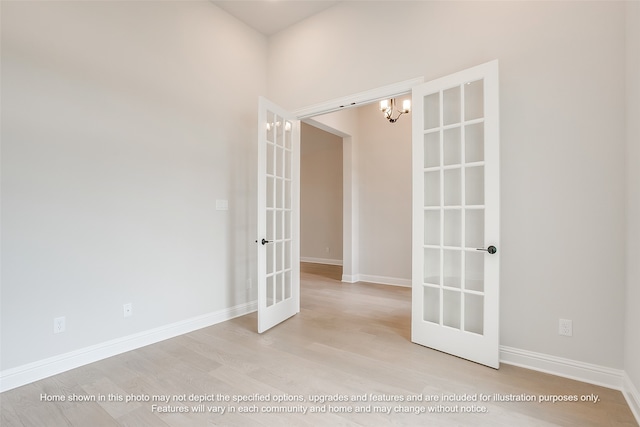 230 Olson Rd, Waxahachie, TX 75167 - unfurnished room featuring french doors, a chandelier, and wood finished floors