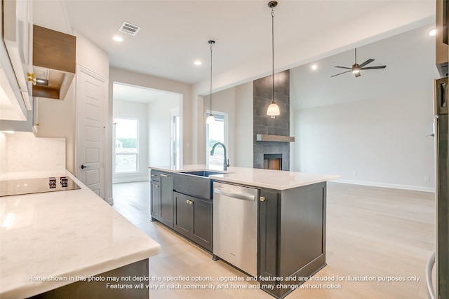 230 Olson Rd, Waxahachie, TX 75167 - kitchen featuring stainless steel dishwasher, black electric stovetop, open floor plan, light wood-type flooring, and recessed lighting