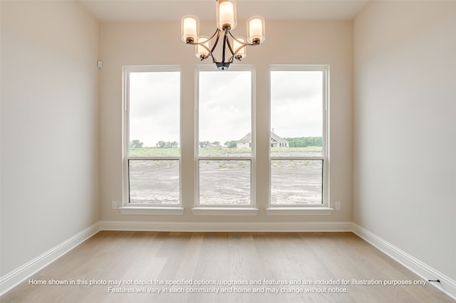 230 Olson Rd, Waxahachie, TX 75167 - unfurnished dining area with healthy amount of natural light, a chandelier, and light wood-style flooring