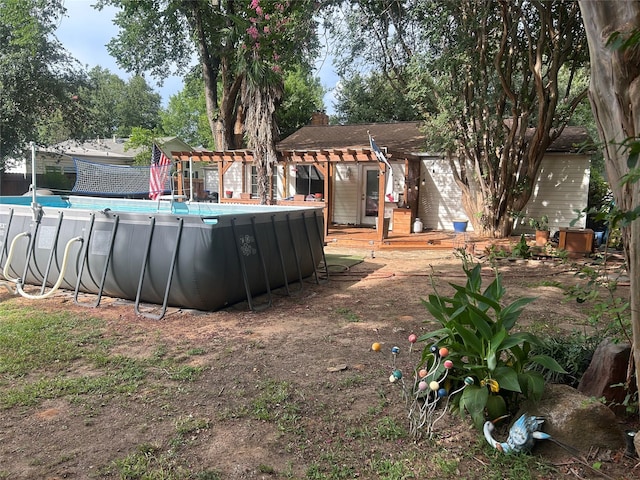625 N Bailey Ave, Fort Worth, TX 76107 - swimming pool featuring a wooden deck and a pergola