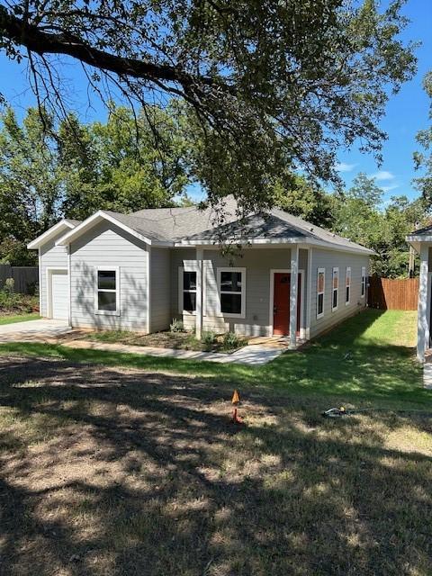 1119 W Johnson St, Denison, TX 75020 - view of front of home featuring an attached garage
