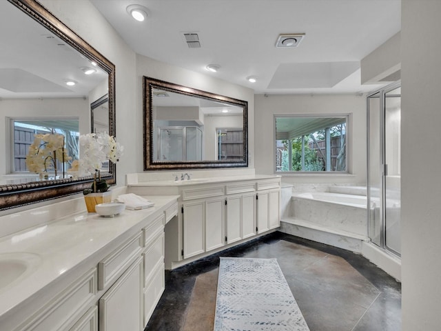 4029 Tumbril Ln, Plano, TX 75023 - bathroom with a bath, double vanity, a shower stall, and concrete floors