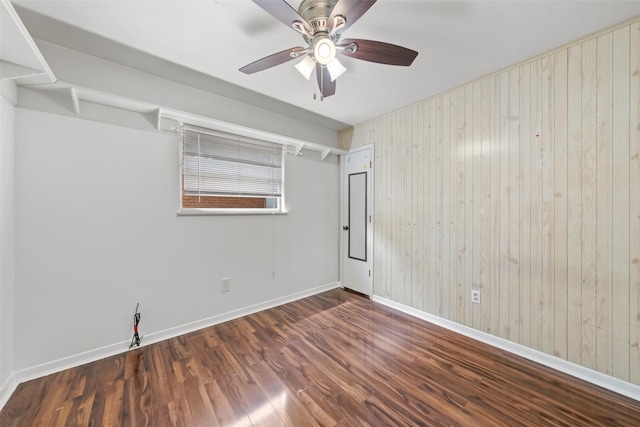 210 Virginia Dr, Waco, TX 76705 - unfurnished room with wood finished floors, ceiling fan, and wooden walls