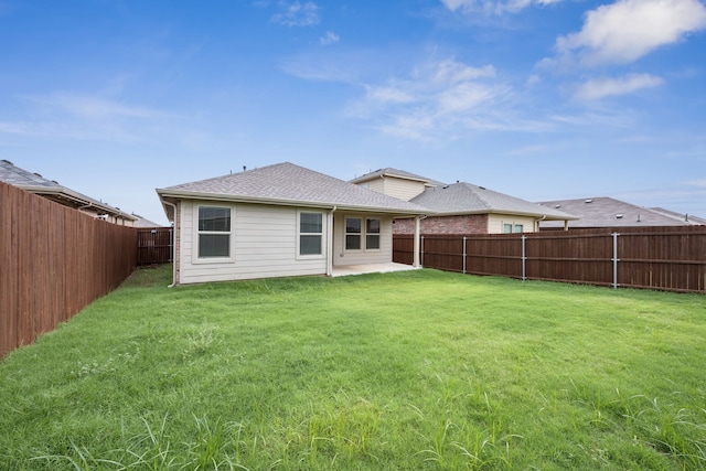 124 Greengate Dr, Boyd, TX 76023 - rear view of house with a fenced backyard, a patio area, and roof with shingles