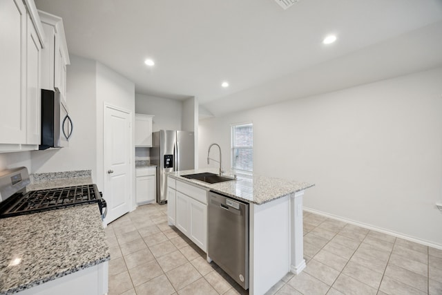 124 Greengate Dr, Boyd, TX 76023 - kitchen featuring stainless steel appliances, light tile patterned floors, a kitchen island with sink, white cabinetry, and recessed lighting