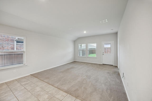 124 Greengate Dr, Boyd, TX 76023 - carpeted empty room with lofted ceiling and tile patterned floors