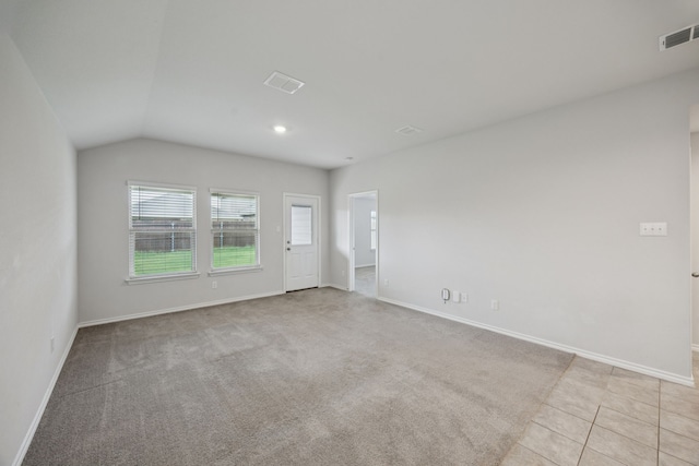 124 Greengate Dr, Boyd, TX 76023 - empty room featuring vaulted ceiling, tile patterned floors, carpet, and recessed lighting