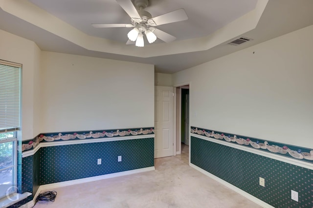 8 Sterling Ranch Rd N, Haughton, LA 71037 - empty room with wallpapered walls, a ceiling fan, light carpet, and wainscoting