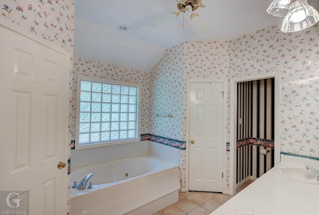 8 Sterling Ranch Rd N, Haughton, LA 71037 - bathroom featuring wallpapered walls, a tub with jets, tile patterned floors, vaulted ceiling, and vanity