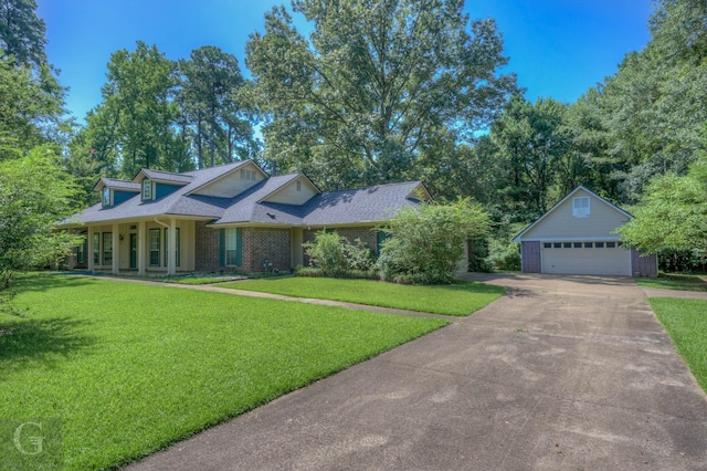 8 Sterling Ranch Rd N, Haughton, LA 71037 - view of front of home with an outdoor structure, brick siding, a front yard, and concrete driveway