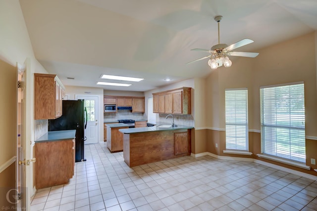 8 Sterling Ranch Rd N, Haughton, LA 71037 - kitchen featuring black appliances, a peninsula, light tile patterned flooring, and tasteful backsplash