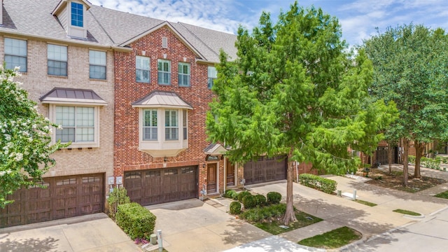 1416 Chase Ln, Irving, TX 75063 - multi unit property with brick siding, driveway, an attached garage, and roof with shingles