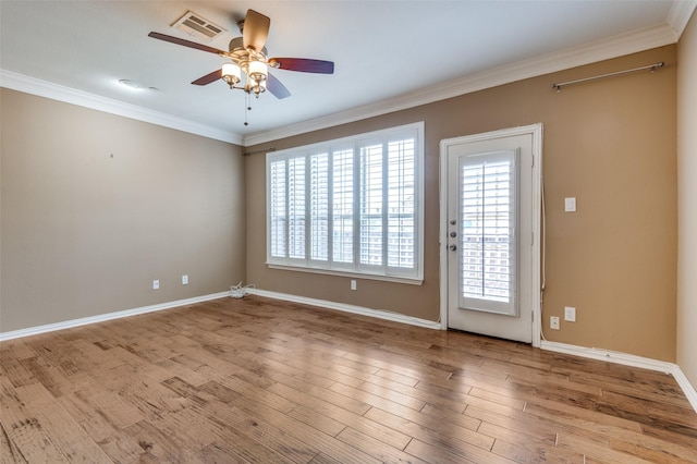 1416 Chase Ln, Irving, TX 75063 - spare room featuring ceiling fan, ornamental molding, and wood finished floors