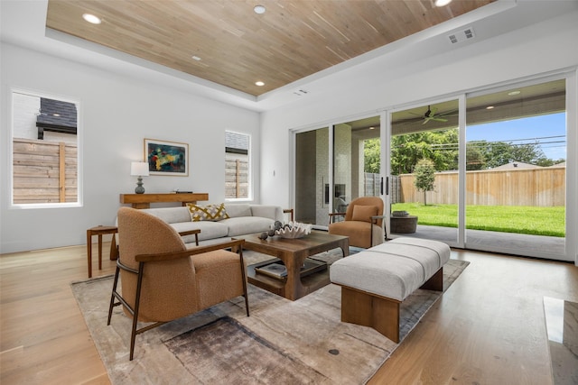 7523 Robin Rd, Dallas, TX 75209 - living room with a tray ceiling, wood finished floors, wood ceiling, plenty of natural light, and recessed lighting