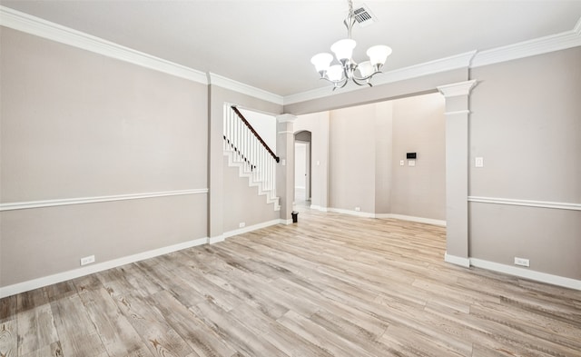 614 Heatherglen Dr, Southlake, TX 76092 - empty room featuring arched walkways, crown molding, a chandelier, wood finished floors, and stairs