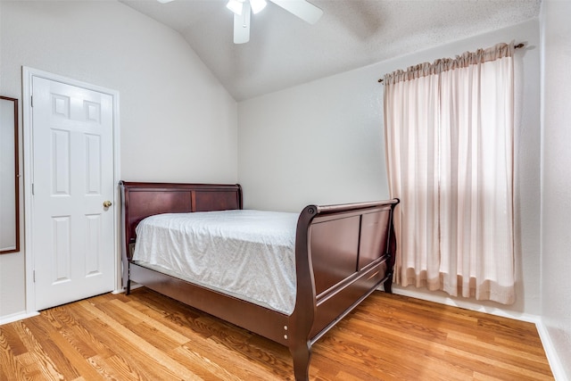 7012 Hillshire Ln, Sachse, TX 75048 - bedroom with vaulted ceiling, light wood finished floors, and ceiling fan