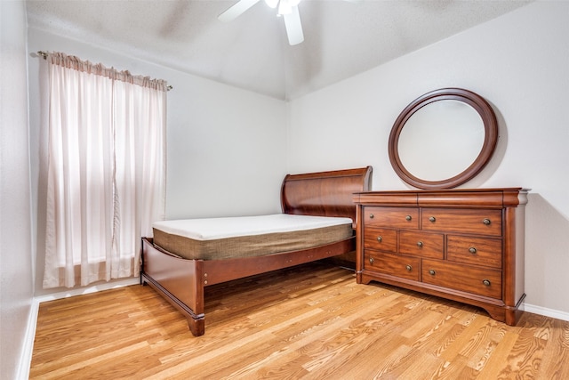 7012 Hillshire Ln, Sachse, TX 75048 - bedroom with light wood-type flooring, lofted ceiling, and ceiling fan