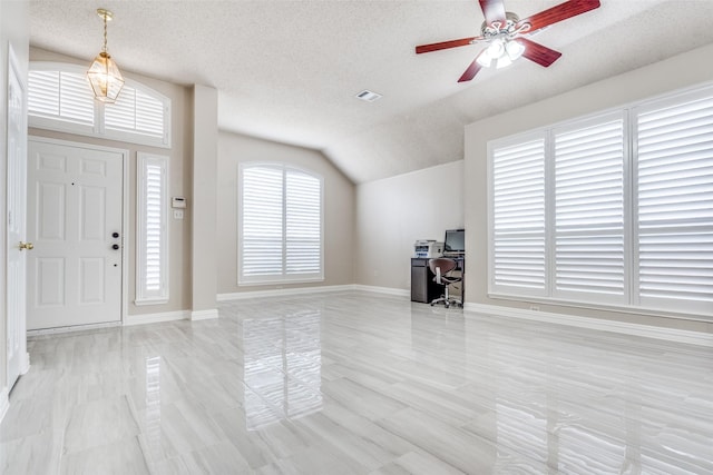 7012 Hillshire Ln, Sachse, TX 75048 - entryway featuring a textured ceiling, vaulted ceiling, and ceiling fan