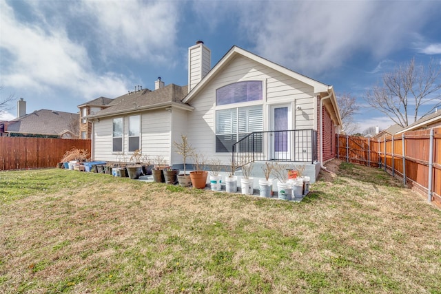 7012 Hillshire Ln, Sachse, TX 75048 - rear view of property with a fenced backyard and a chimney