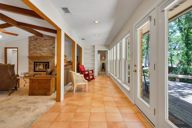 2815 Whisperwood Trl, Dalworthington Gardens, TX 76016 - corridor featuring built in shelves, light tile patterned flooring, a textured ceiling, lofted ceiling, and recessed lighting