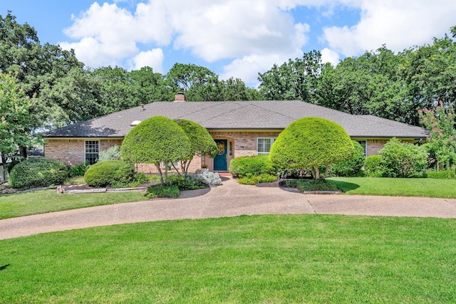2815 Whisperwood Trl, Dalworthington Gardens, TX 76016 - view of front of property featuring a front lawn, brick siding, a chimney, and driveway