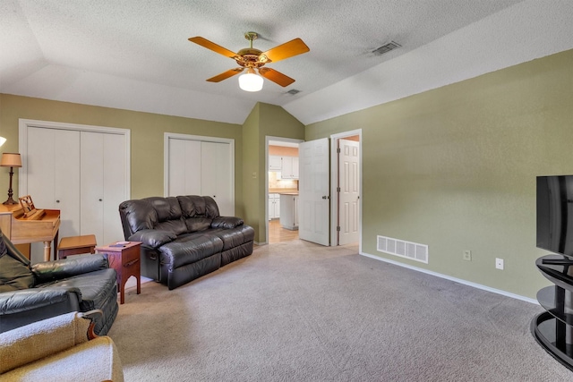 2815 Whisperwood Trl, Dalworthington Gardens, TX 76016 - living area with lofted ceiling, a ceiling fan, light carpet, and a textured ceiling