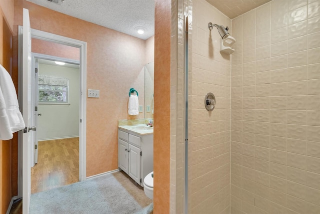 2815 Whisperwood Trl, Dalworthington Gardens, TX 76016 - bathroom with a stall shower, vanity, and wood finished floors