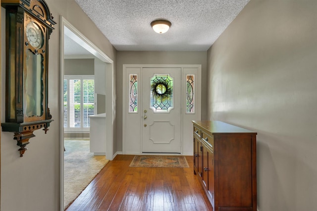 2815 Whisperwood Trl, Dalworthington Gardens, TX 76016 - foyer entrance with dark wood-style floors and a textured ceiling