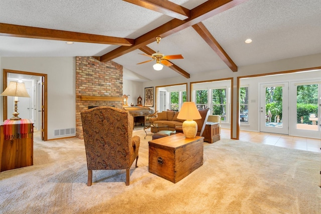 2815 Whisperwood Trl, Dalworthington Gardens, TX 76016 - living area featuring light colored carpet, a textured ceiling, a brick fireplace, plenty of natural light, and recessed lighting