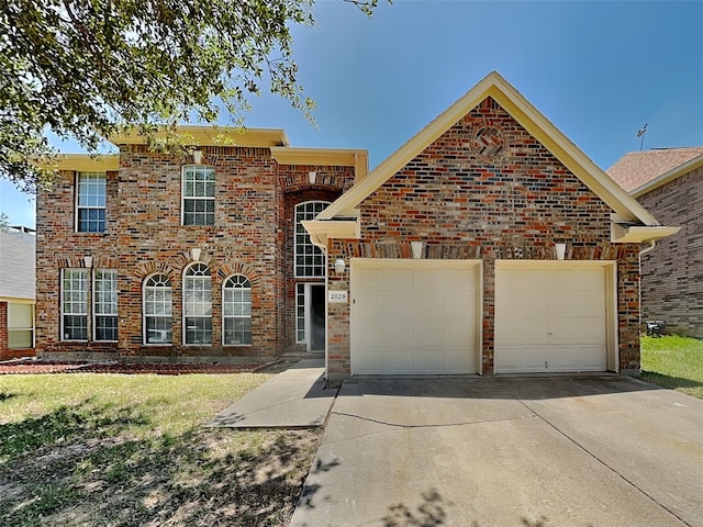2829 Alcot Ln, Grand Prairie, TX 75052 - view of front of property featuring an attached garage, concrete driveway, brick siding, and a front lawn