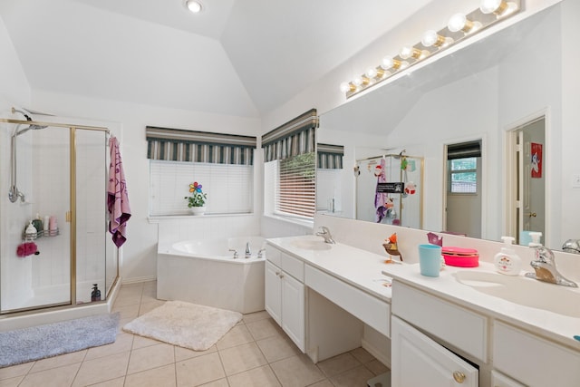 8479 Firewheel Ln, Frisco, TX 75036 - full bath with vaulted ceiling, double vanity, a shower stall, a bath, and tile patterned floors