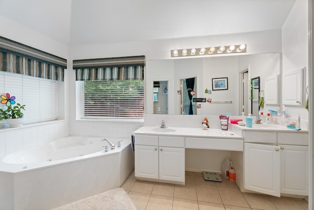 8479 Firewheel Ln, Frisco, TX 75036 - full bath featuring double vanity, tile patterned flooring, and a jetted tub
