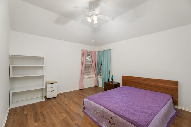 8479 Firewheel Ln, Frisco, TX 75036 - bedroom featuring wood finished floors and a ceiling fan