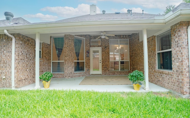 8479 Firewheel Ln, Frisco, TX 75036 - view of exterior entry with brick siding and ceiling fan