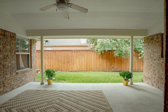 8479 Firewheel Ln, Frisco, TX 75036 - fenced backyard featuring a ceiling fan and a patio area