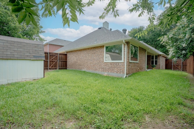 8479 Firewheel Ln, Frisco, TX 75036 - fenced backyard featuring a gate and a storage unit