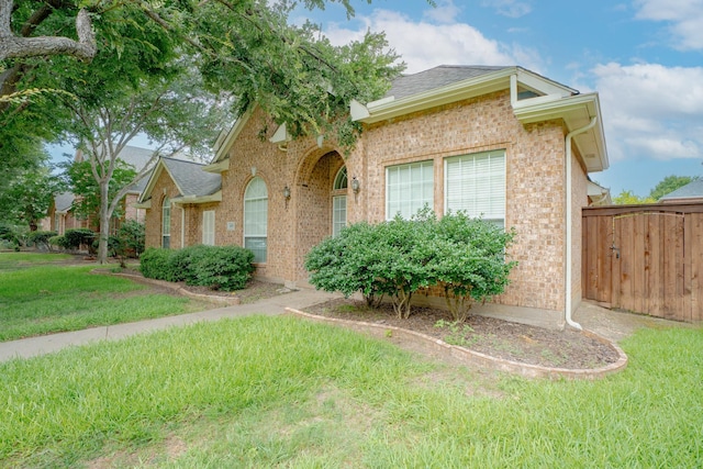 8479 Firewheel Ln, Frisco, TX 75036 - view of front of house featuring brick siding and a shingled roof