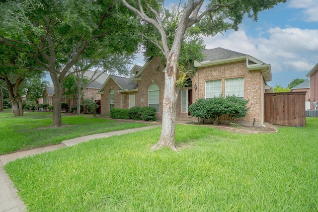 8479 Firewheel Ln, Frisco, TX 75036 - view of front of property featuring brick siding and a shingled roof