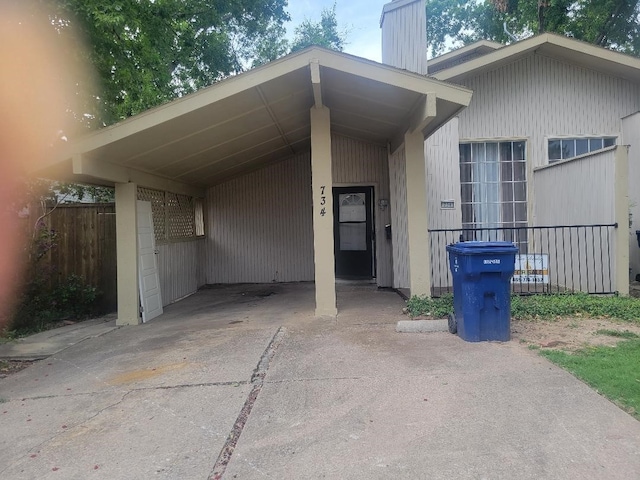 734 Sceptre Cir, Garland, TX 75043 - view of parking featuring concrete driveway and an attached carport