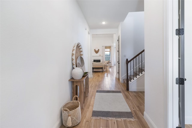 1604 Berry Ridge Trl, Aubrey, TX 76227 - hallway featuring stairway, wood finished floors, and recessed lighting