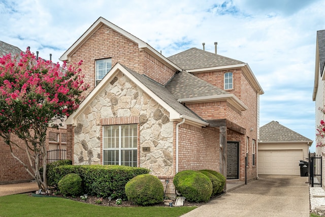 11116 Elizabeth Ave, Frisco, TX 75035 - view of front of house featuring roof with shingles, driveway, stone siding, and brick siding