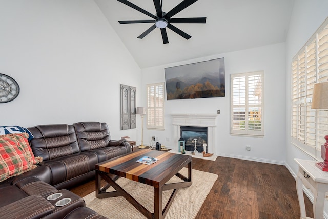 11116 Elizabeth Ave, Frisco, TX 75035 - living room with a ceiling fan, dark wood-type flooring, high vaulted ceiling, and a glass covered fireplace
