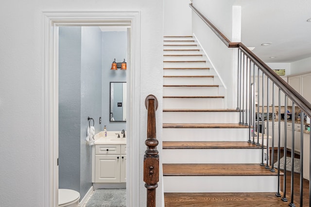 11116 Elizabeth Ave, Frisco, TX 75035 - staircase featuring baseboards and a textured wall