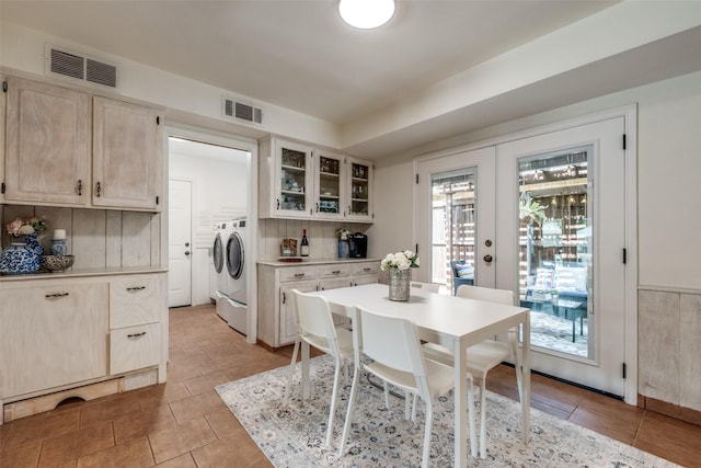 6342 E Lovers Ln, Dallas, TX 75214 - dining space featuring separate washer and dryer, light tile patterned flooring, and french doors