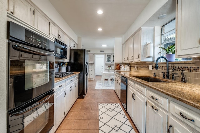 6342 E Lovers Ln, Dallas, TX 75214 - kitchen featuring black appliances, tasteful backsplash, white cabinetry, and recessed lighting